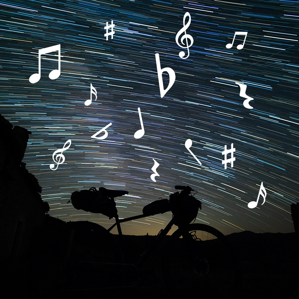 Bicicleta con rastro de estrellas y notas musicales